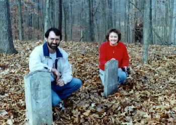 Graves of William R. and Eliza J. Rives - Dave Bodine and Sally (Bodine) Snyder are in the picture