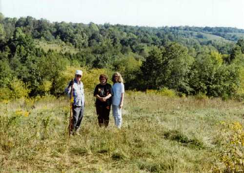Picture
taken of Isaac's land facing south toward Jesse's Run. This is the possible
location of his house (my parents and wife in picture).